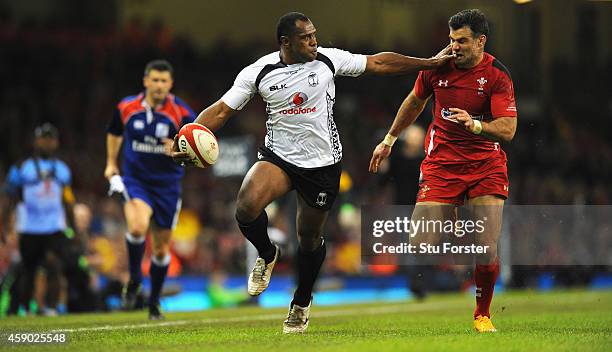 Wales player Mike Phillips is fended off by Fiji player Vereniki Goneva during the International match between Wales and Fiji at Millennium Stadium...