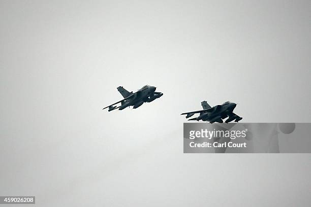 Two Royal Air Force Tornado GR4s prepare to arrive at Royal Air Force Marham on November 15, 2014 near the village of Marham in the English county of...