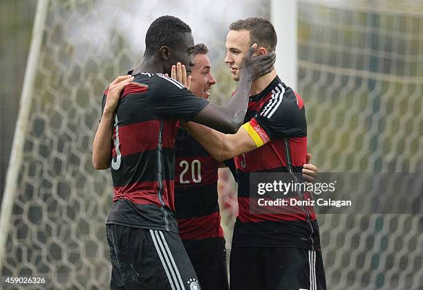 Prince Osei Owusu, David Sauerland and Benedikt Gimber of Germany celebrating the third goal for their team during the international friendly match...