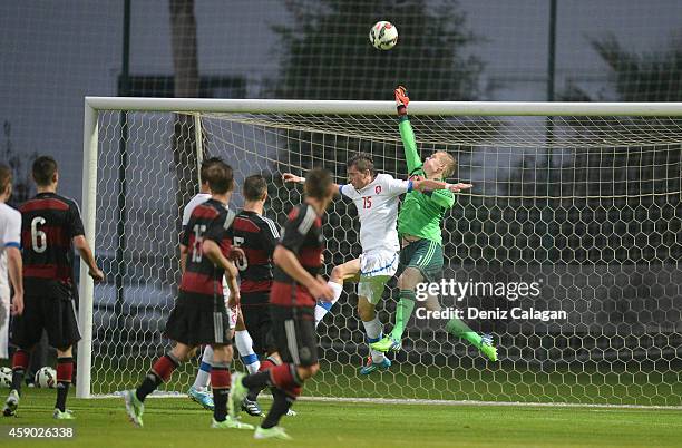 Petr Prucha of Czech Republic challenges goalkeeper Dominik Reimann of Germany during the international friendly match between U18 Germany and U18...