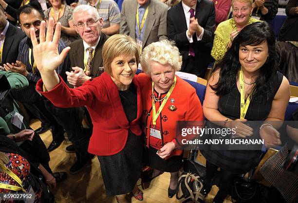 New leader of the Scottish National Party Nicola Sturgeon poses for pictures with delegates as she delivers her first keynote speech at the SNP...