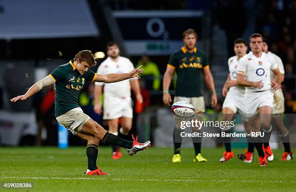 Pat Lambie of South Africa kicks a drop goal during the QBE Intenational match between England and South Africa at Twickenham Stadium on November 15,...