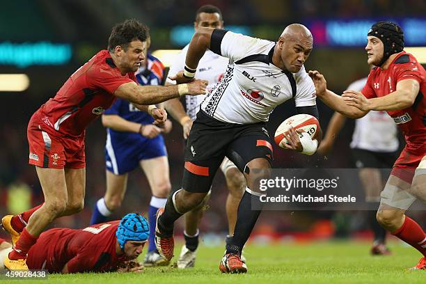 Nemani Nadolo of Fiji powers his way past Mike Phillips and Nicky Smith of Wales during the International match between Wales and Fiji at the...