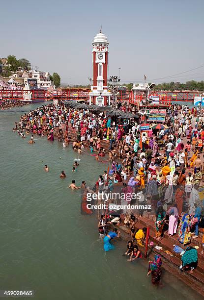 pilgrims bathing in ganges for kumbh mela - religious role stock pictures, royalty-free photos & images