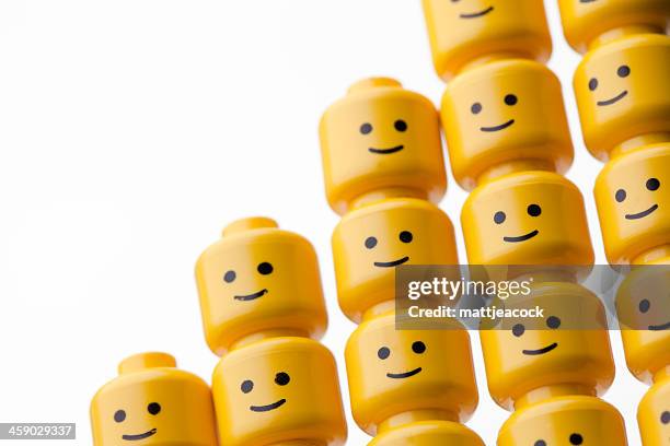 lego figure heads - lego stock pictures, royalty-free photos & images
