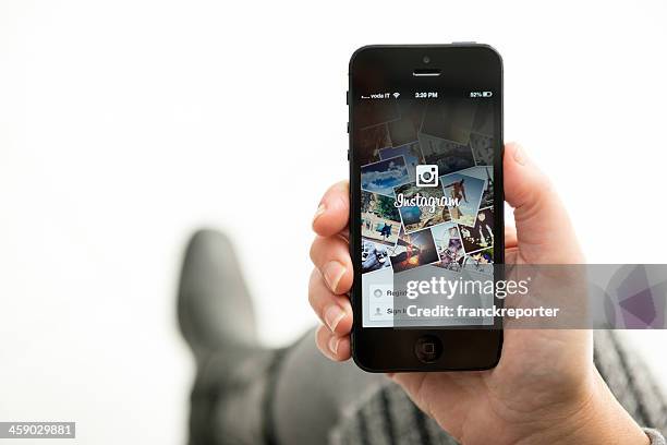 iphone 5 with the instagram app landing page - mobile landing page stock pictures, royalty-free photos & images