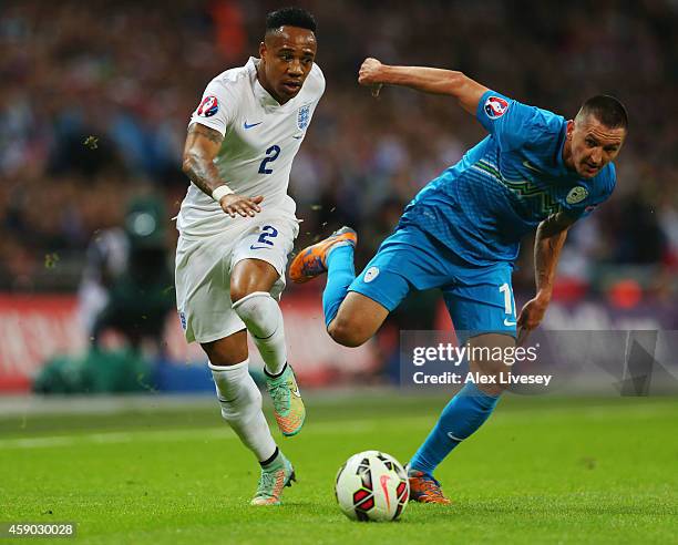 Nathaniel Clyne of England battles with Andraz Kirm of Slovenia during the EURO 2016 Qualifier Group E match between England and Slovenia at Wembley...