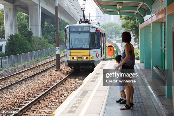 light rail transit (lrt) in hong kong - tuen mun stock pictures, royalty-free photos & images