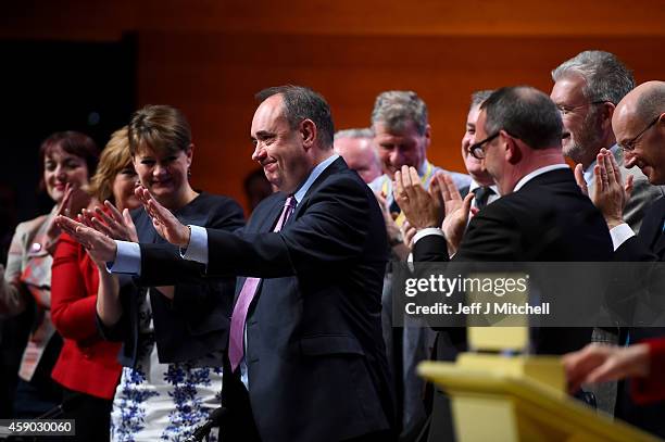 Former SNP leader Alex Salmond is given a standing ovation as Nicola Sturgeon, gives her first key note speech as SNP party leader at the partys...