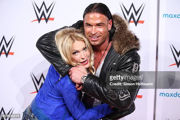 Tim Wiese poses with Sonya Kraus prior to WWE Live 2014 at Festhalle on November 15, 2014 in Frankfurt am Main, Germany.
