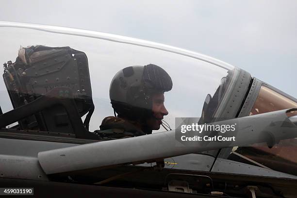 Pilot sits inside a Royal Air Force Tornado GR4 arriving on the runway at Royal Air Force Marham on November 15, 2014 near the village of Marham in...