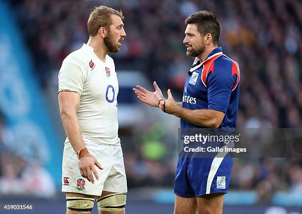 Captain Chris Robshaw of England speaks with referee Steve Walsh during the QBE International match between England and South Africa at Twickenham...