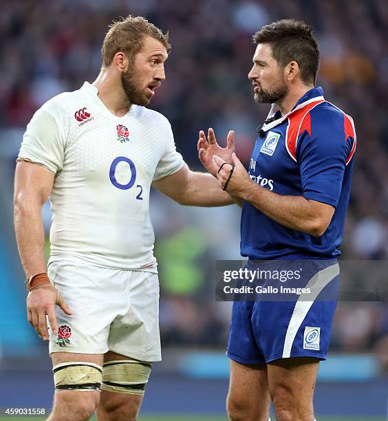 Captain Chris Robshaw of England speaks with referee Steve Walsh during the QBE International match between England and South Africa at Twickenham...