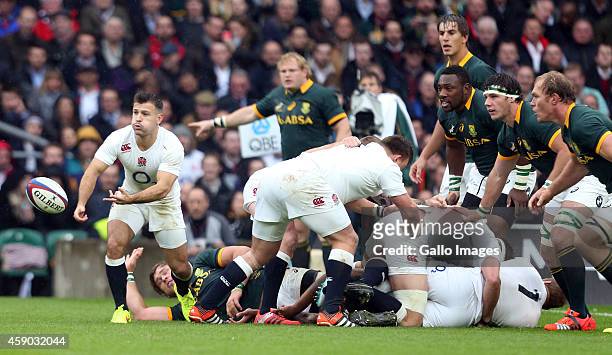 Danny Care of England gpasses the ball during the QBE International match between England and South Africa at Twickenham Stadium on November 15, 2014...