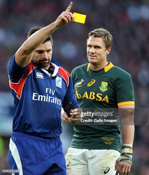 Referee Steve Walsh holds up a yellow card for Dylan Hartley of England during the QBE International match between England and South Africa at...