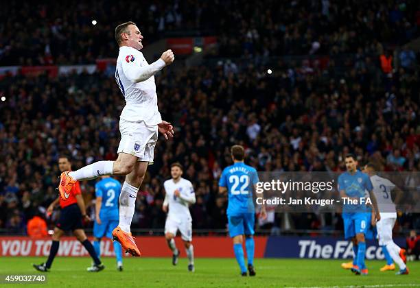 Wayne Rooney of England celebrates after scoring his team's first goal from the penalty spot during the EURO 2016 Group E Qualifier match between...