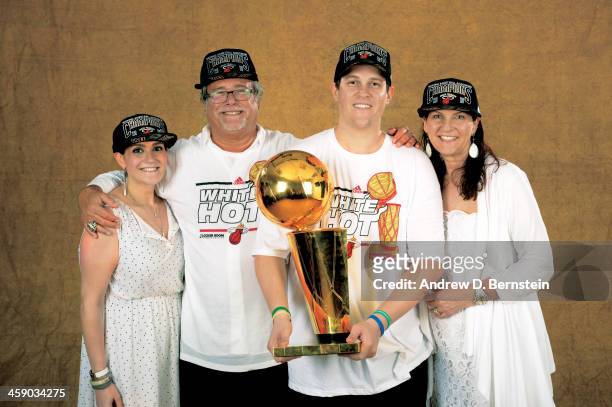 Owner Micky Arison of the Miami Heat poses for a portrait with the Larry O'Brien Trophy after defeating the San Antonio Spurs in Game Seven of the...