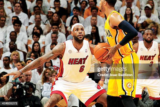 LeBron James of the Miami Heat plays defense against Paul George of the Indiana Pacers in Game Two of the Eastern Conference Finals during the 2013...