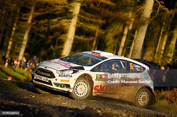 Henning Solberg of Norway and Ilka Minor of Austria compete in their Henning Solberg Ford Fiesta RS WRC during Day Two of the WRC Great Britain on...