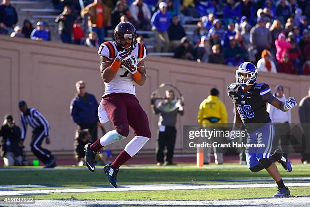 Bucky Hodges of the Virginia Tech Hokies catches the game-winning touchdown against Jeremy Cash of the Duke Blue Devils during fourth quarter of...