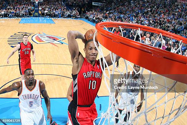DeMar DeRozan of the Toronto Raptors drives to the basket against the Oklahoma City Thunder on December 22, 2013 at the Chesapeake Energy Arena in...