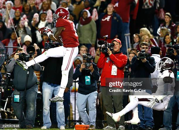 Cyrus Jones of the Alabama Crimson Tide intercepts a touchdown reception intended for De'Runnya Wilson of the Mississippi State Bulldogs at...