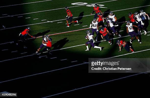 Wide receiver John Ross of the Washington Huskies returns a kick off against the Arizona Wildcats during the fourth quarter of the college football...