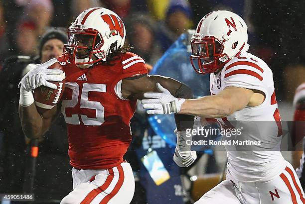 Melvin Gordon of the Wisconsin Badgers runs the ball against Nate Gerry of the Nebraska Cornhuskers at Camp Randall Stadium on November 15, 2014 in...