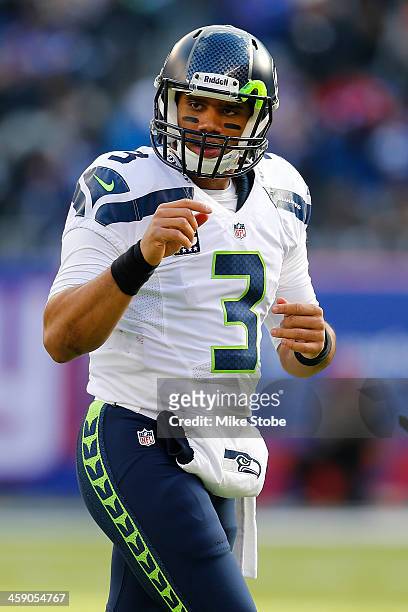 Russell Wilson of the Seattle Seahawks in action against the New York Giants at MetLife Stadium on December 15, 2013 in East Rutherford, New Jersey....