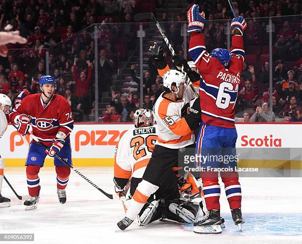 Max Pacioretty of the Montreal Canadiens celebrates the goal scored by Pierre-Alexandre Parenteau against the Philadelphia Flyers in the NHL game at...
