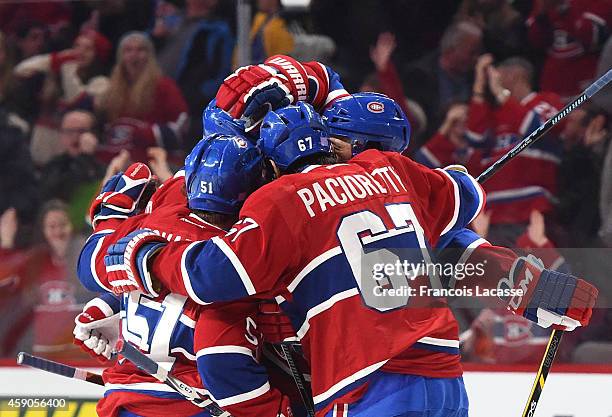 Pierre-Alexandre Parenteau of the Montreal Canadiens celebrates with Max Pacioretty and David Desharnais after scoring a goal against of the...