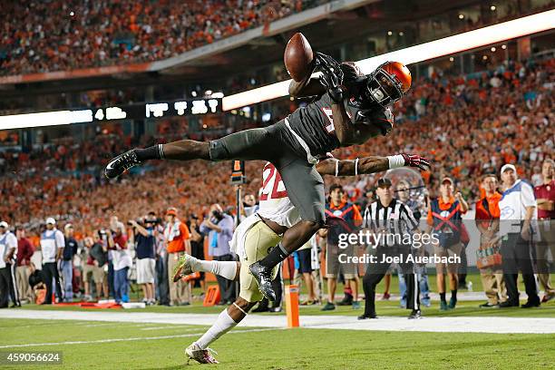 Phillip Dorsett of the Miami Hurricanes is unable to catch the ball for a touchdown while being defended by P.J. Williams of the Florida State...