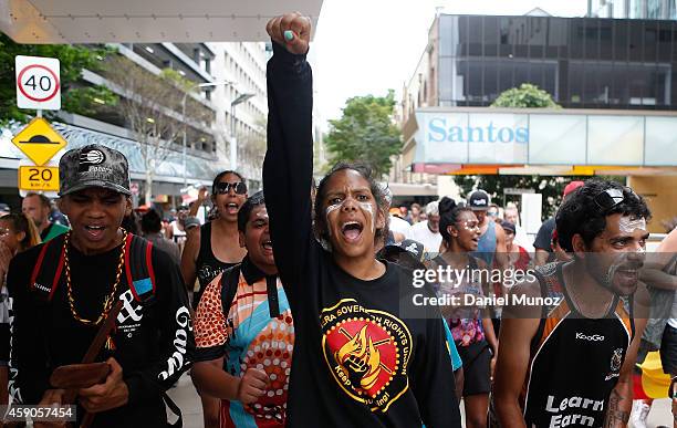 Woman shouts slogans demanding Australian Aboriginal rights and against the G20 leaders on November 16, 2014 in Brisbane, Australia. World leaders...