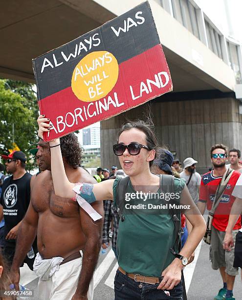 Woman shouts slogans demanding Australian Aboriginal rights and against the G20 leaders on November 16, 2014 in Brisbane, Australia. World leaders...