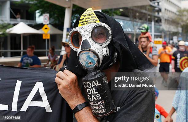 Man attends a protests for Australian Aboriginal rights and against the G20 leaders on November 16, 2014 in Brisbane, Australia. World leaders have...