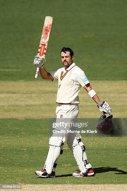 Callum Ferguson of the SA Redbacks celebrates after reaching 100 runs during day one of the Sheffield Shield match between South Australia and...