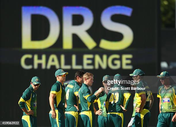 Nathan Coulter-Nile of Australia and his teammates wait after appealing successfully for LBW against Faf du Plessis of South Africa but the decision...