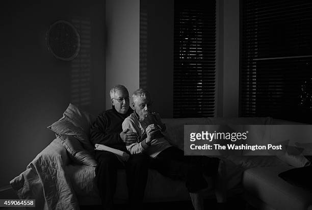 David Schwarz left, sits next to his husband and partner of 36 years, Stephen Lee inside their home in the Dupont neighborhood, December 30, 2013 in...