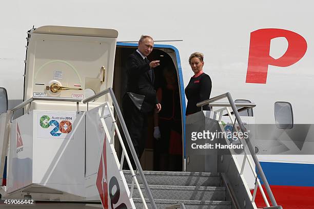 In this handout photo provided by the G20 Australia, Russias President Vladimir Putin departs Brisbane Airport after the the G20 Leaders Summit on...