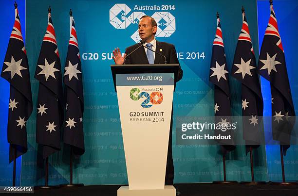 In this handout photo provided by the G20 Australia, Australian Prime Minister Tony Abbott addresses the media at a press conference at the...