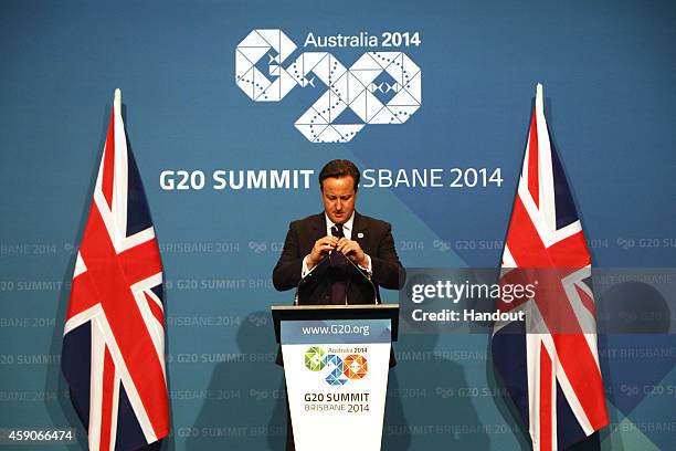 In this handout photo provided by the G20 Australia, United Kingdom's Prime Minister David Cameron addresses the media at a press conference at the...