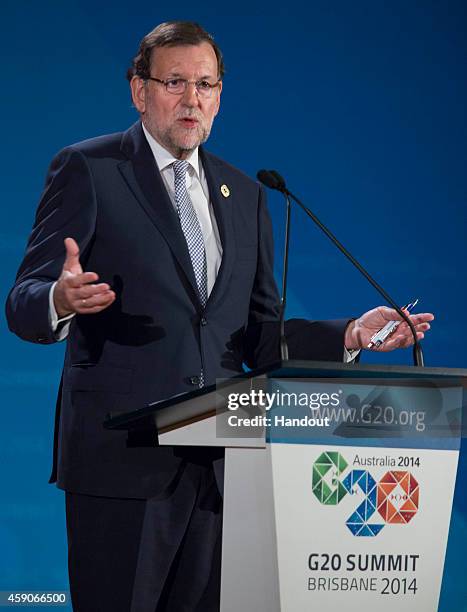 In this handout photo provided by the G20 Australia, Spain's President of the Government Mariano Rajoy Brey addresses the media at a press conference...