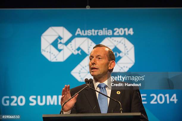 In this handout photo provided by the G20 Australia, Australian Prime Minister Tony Abbott addresses the media at a press conference at the...
