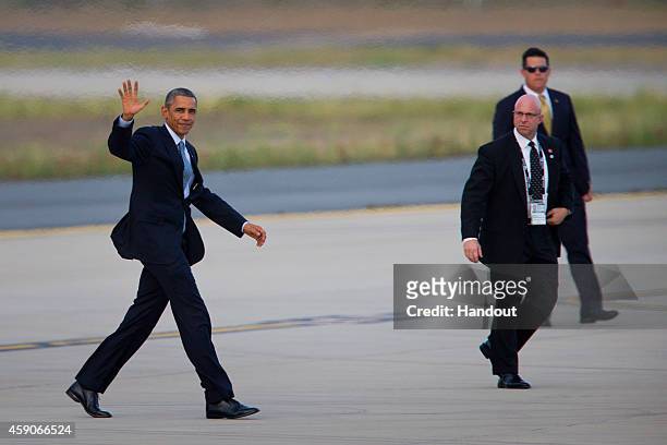 In this handout photo provided by the G20 Australia, U.S. President Barack Obama waves as he departs from Royal Australian Air Force's Base Amberley...