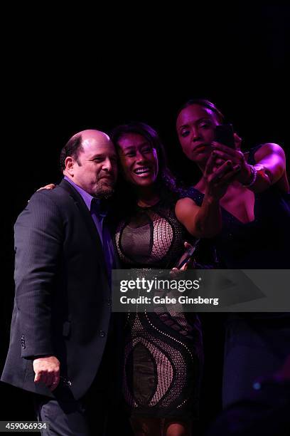 Actor Jason Alexander, honoree and attorney Patricia Lee and actress Aisha Tyler pose for a selfie photo on stage during Live Your Passion Celebrity...