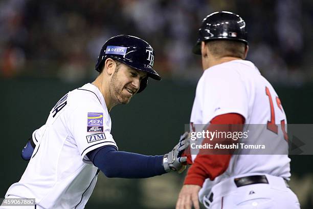 Evan Longoria of the Tampa Bay Rays celebrates after hitting a solo home run in the sixth inning during the game four of Samurai Japan and MLB All...