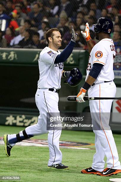 Evan Longoria of the Tampa Bay Rays celebrates after hitting a solo home run during the game four of Samurai Japan and MLB All Stars at Tokyo Dome on...