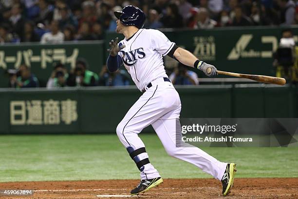Evan Longoria of the Tampa Bay Rays hits a solo home run in the sixth inning during the game four of Samurai Japan and MLB All Stars at Tokyo Dome on...