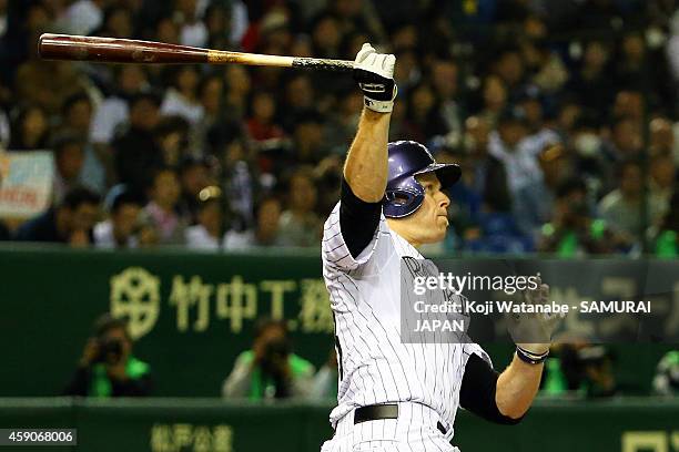 Justin Morneau of the Colorado Rockies hits a three-run homer in the third inning during the game four of Samurai Japan and MLB All Stars at Tokyo...