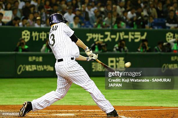 Justin Morneau of the Colorado Rockies hits a three-run homer in the third inning during the game four of Samurai Japan and MLB All Stars at Tokyo...